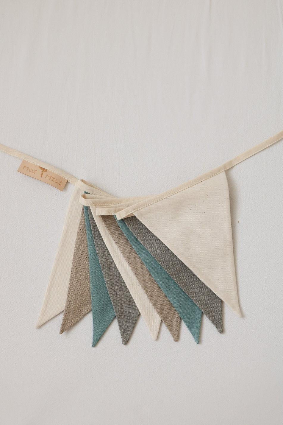 practical 2.2m linen garland hung over a child's play area, showcasing its durable cotton tape and eco-friendly construction