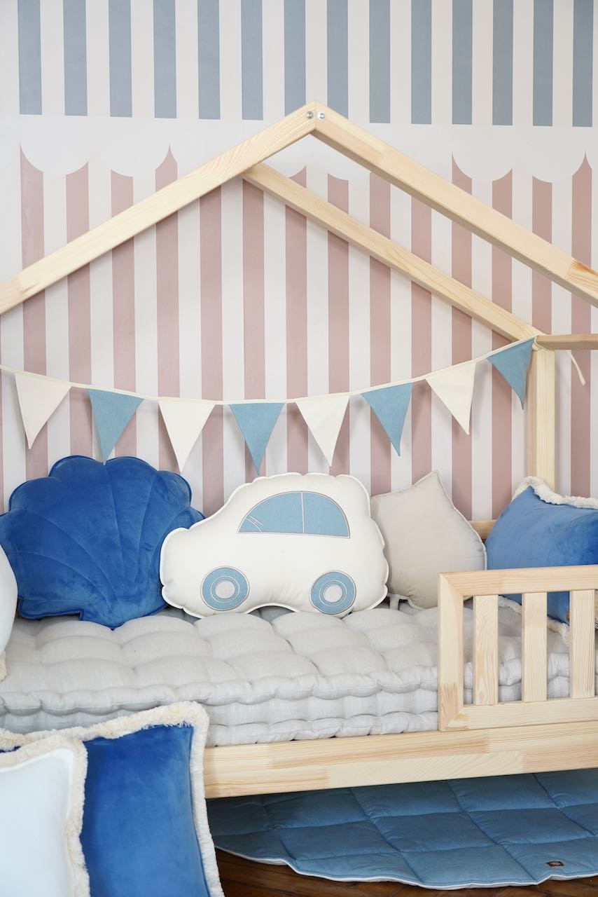 soft cotton and linen garland with 9 powder mint pendants, gently draped over a wooden crib for a cozy nursery touch