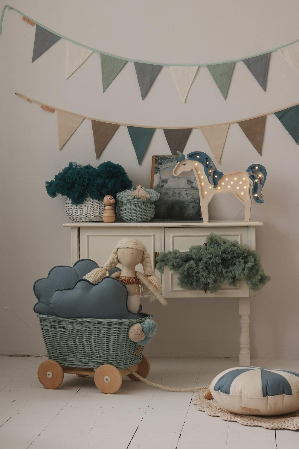 bold mint love garland with nine linen pennants hanging on a dark wall