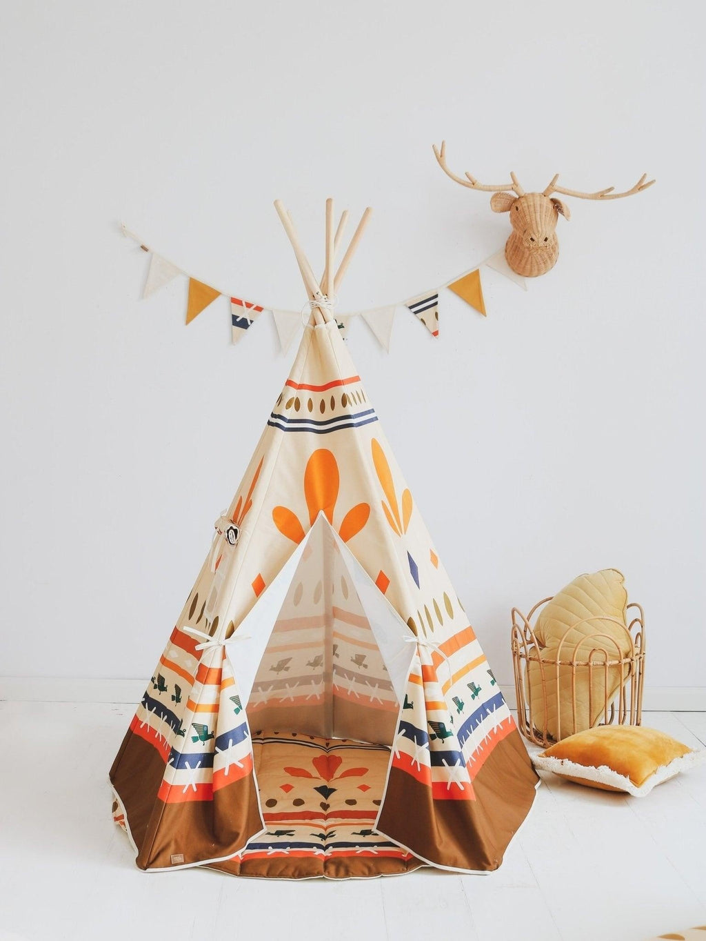 softly lit cotton native vibe garland draped over a cozy nursery shelf