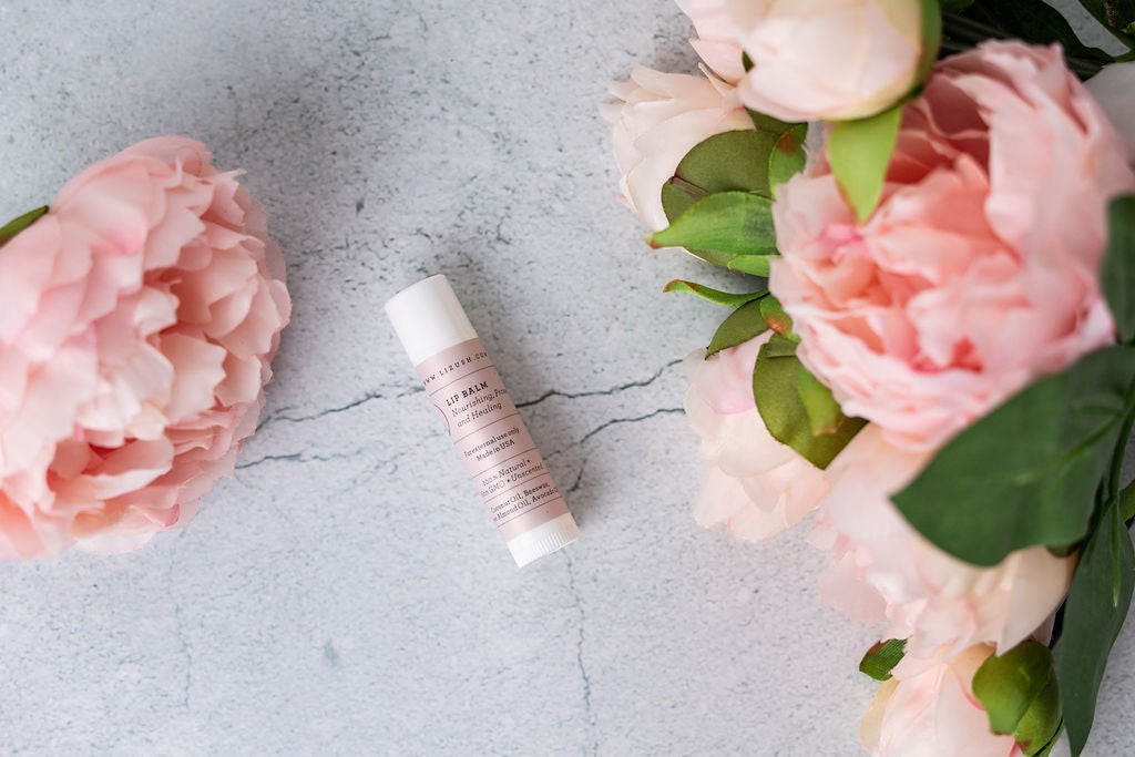 a functional view of the organic mom gift set's practical items like the water bottle and journal laid out