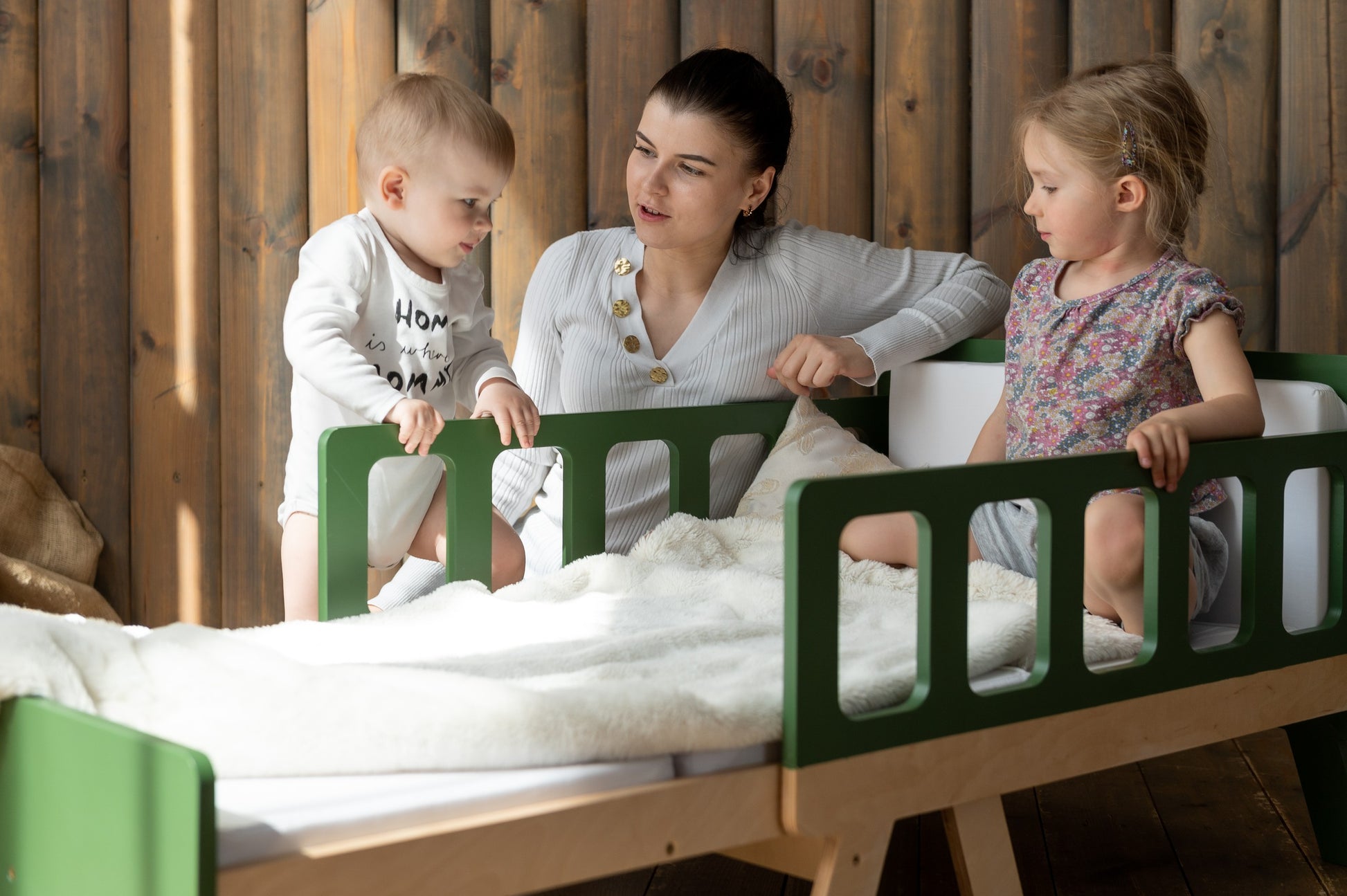 softly lit kids growing bed in a cozy nursery corner with warm morning light