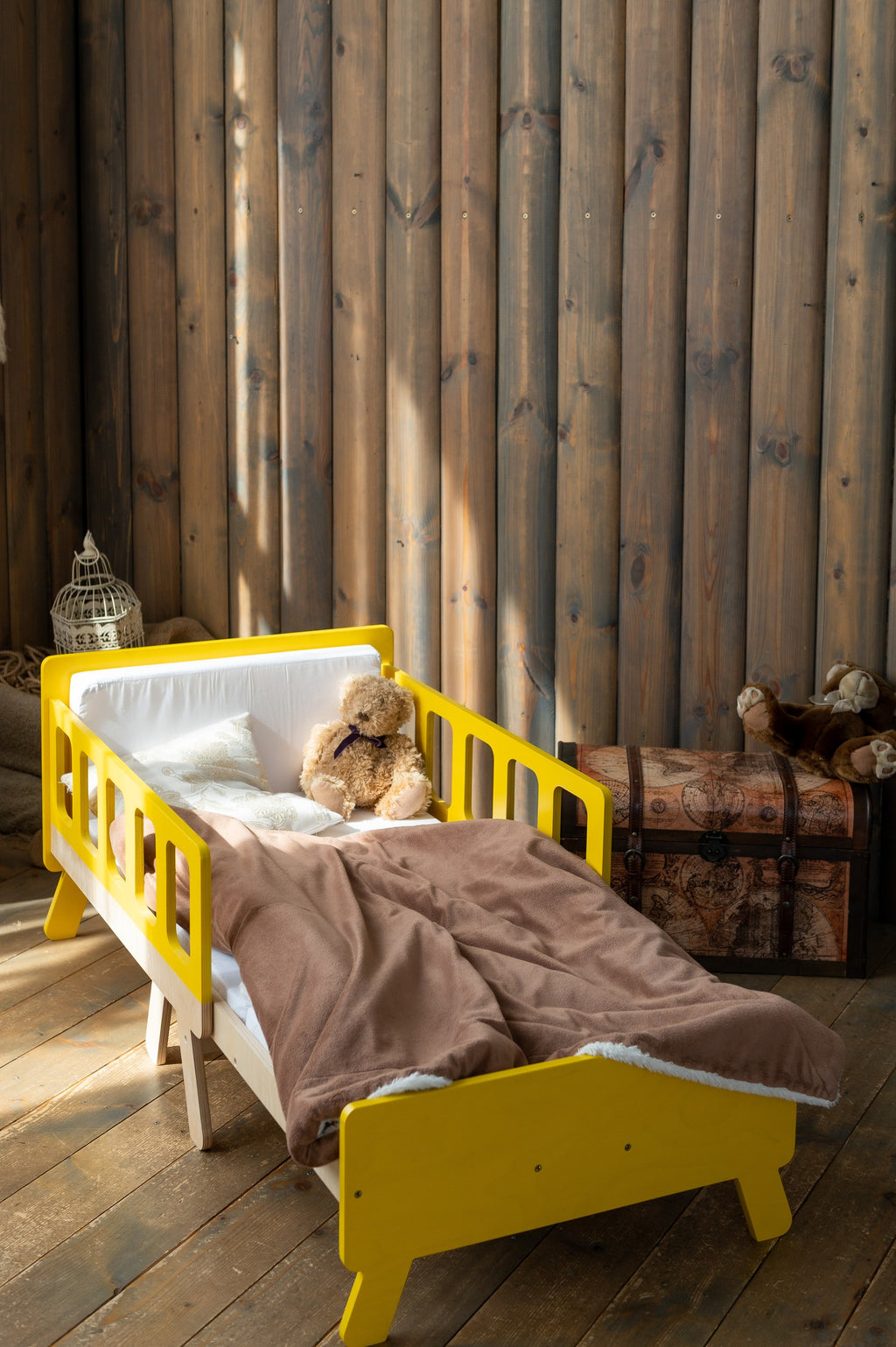 latvian kids growing bed transformed into a cozy daytime sofa for playtime