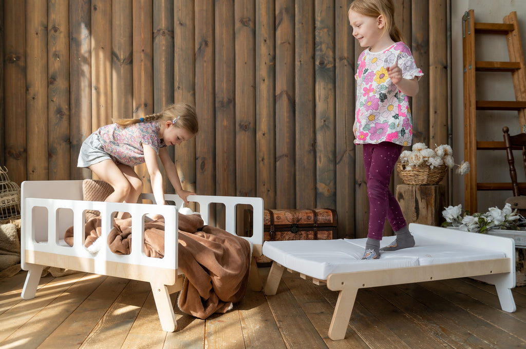 a child's cozy growing bed with soft armrests transformed into a playful daytime sofa