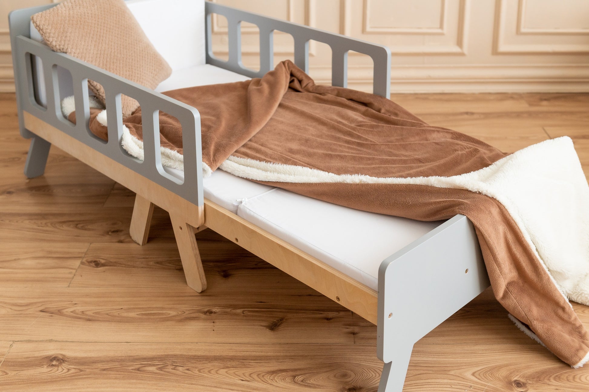 latvian kids growing bed transformed into a cozy daytime sofa for playtime