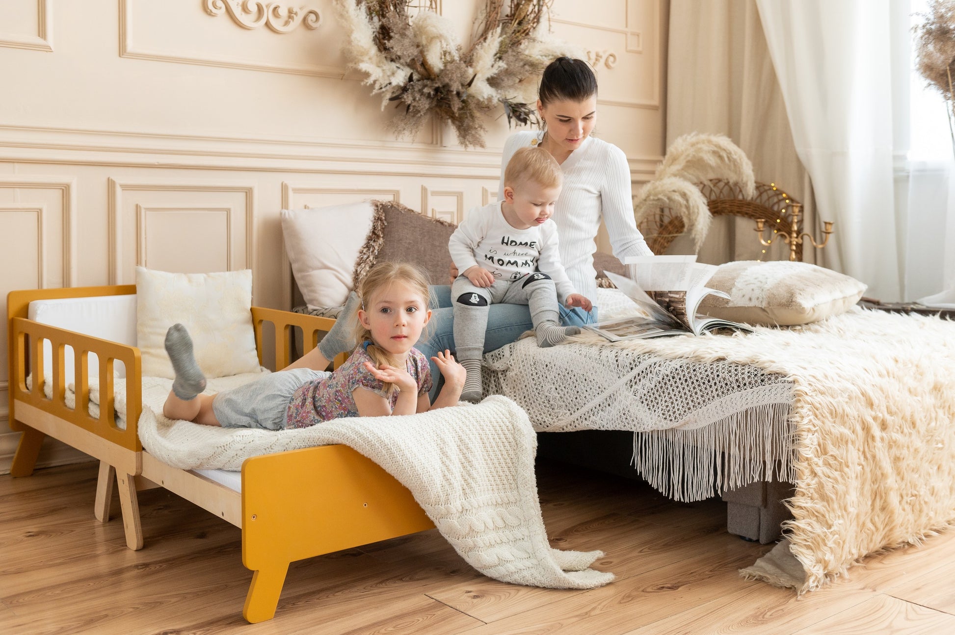 latvian-made kids growing bed in a cozy playroom with soft morning light