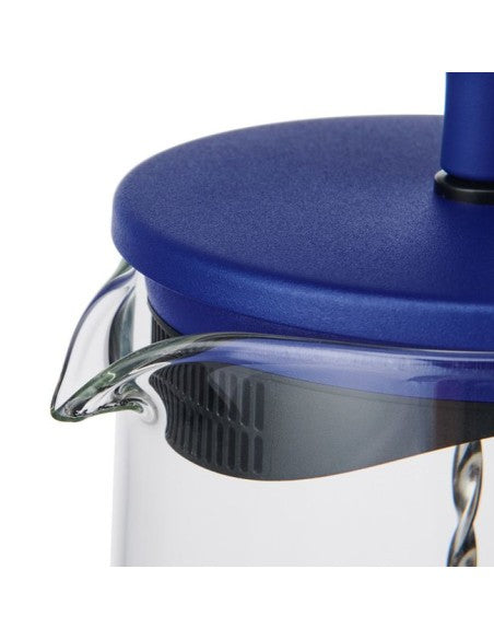 elegant blue gyro teapot on a minimalist table, showcasing its refined design and crystal-clear glass