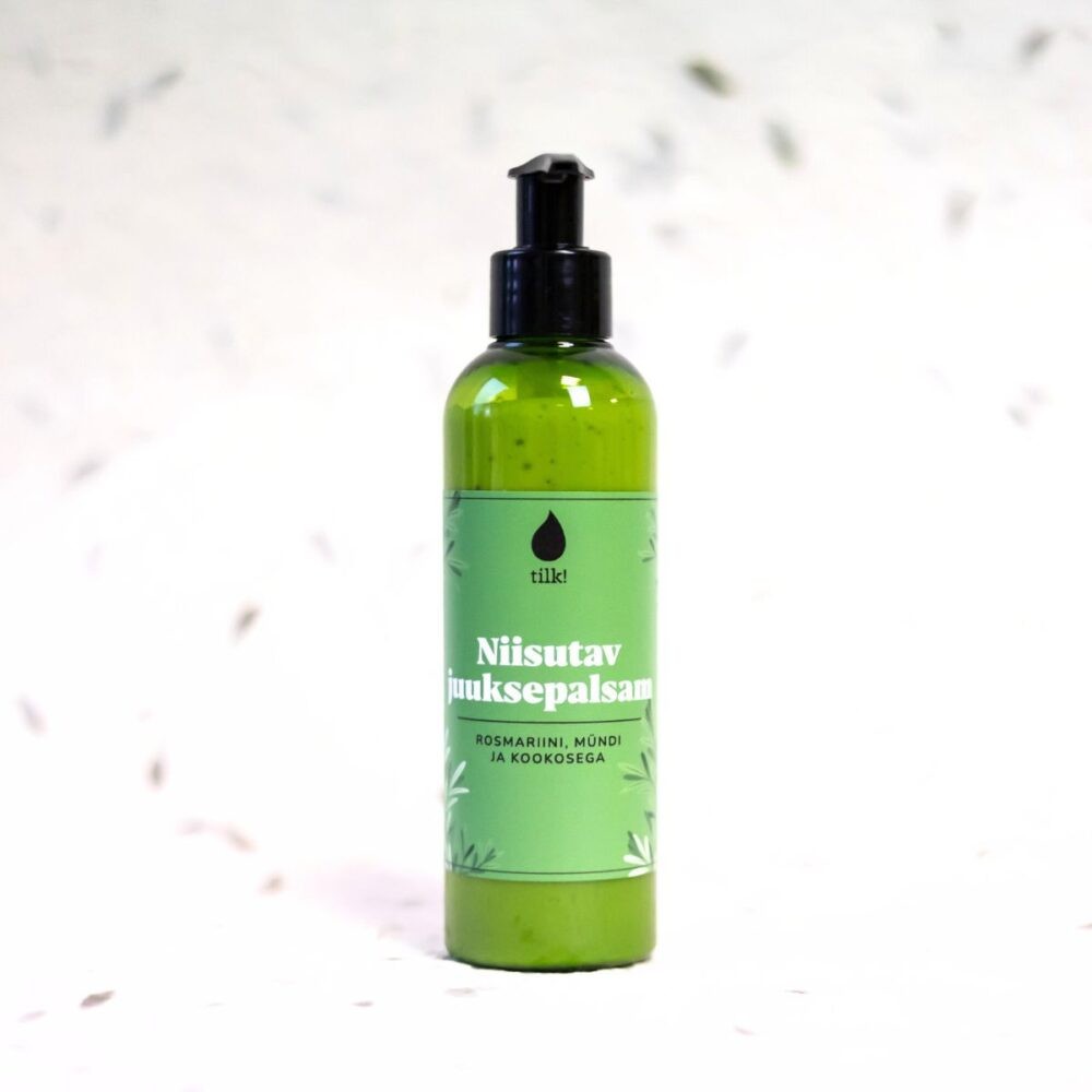bold close-up of revitalizing mint and rosemary hair conditioner bottle with visible coconut texture
