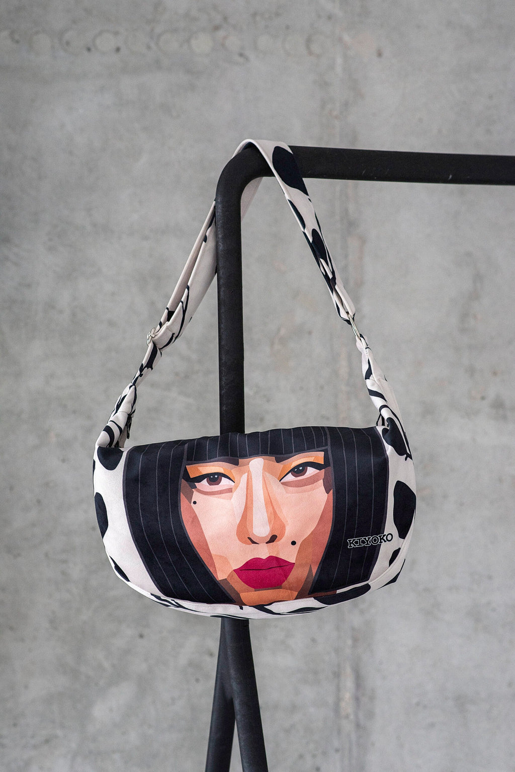 playful kioko velour hobo bag in a sunlit cafe, showing its soft slouch and adjustable strap