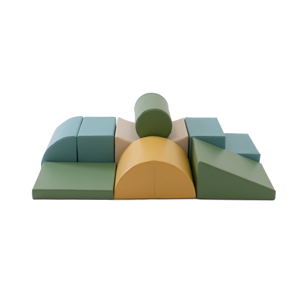 a child building a creative pastel turquoise foam block fort in a sunlit playroom