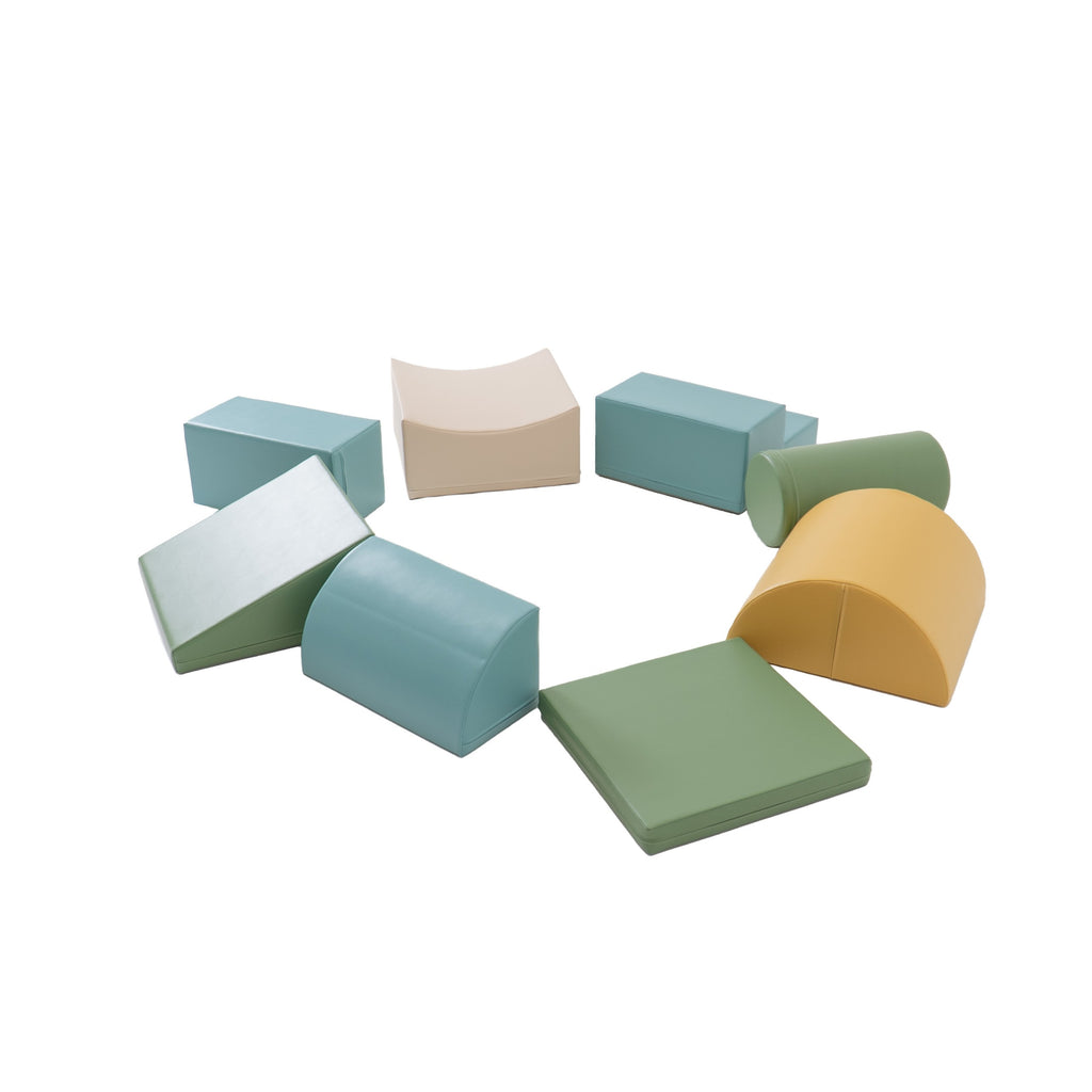 a child's hand stacking a pastel turquoise foam block in a sunlit playroom