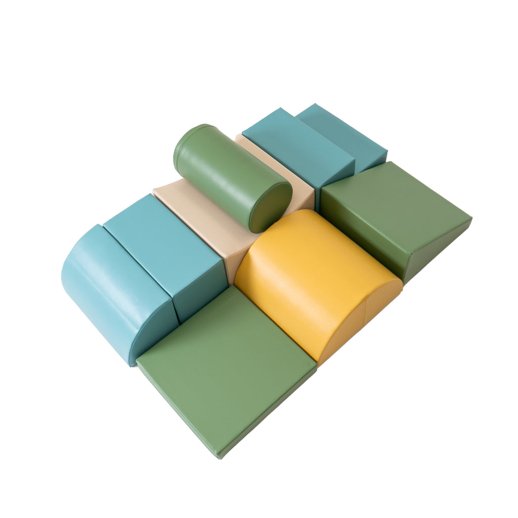 a child building a creative fort with pastel turquoise iglu foam blocks