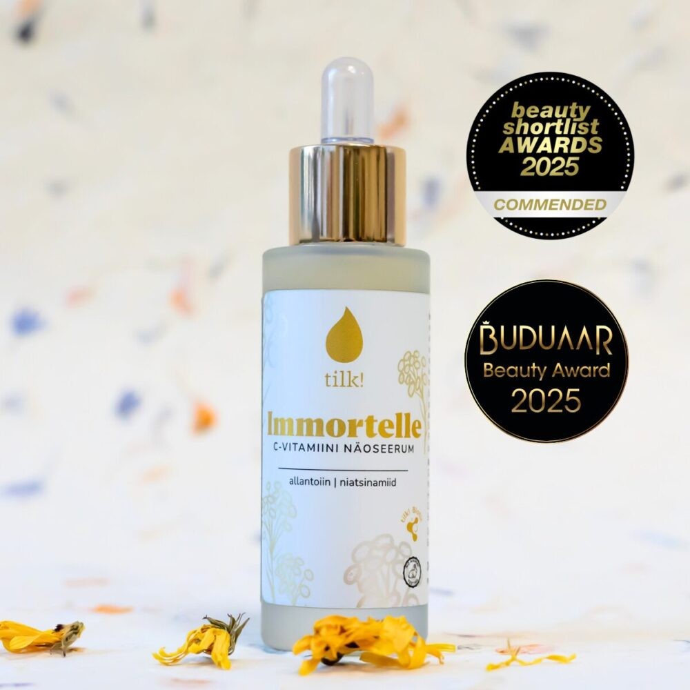 bold close-up of immortelle serum with vitamin c glowing in golden light