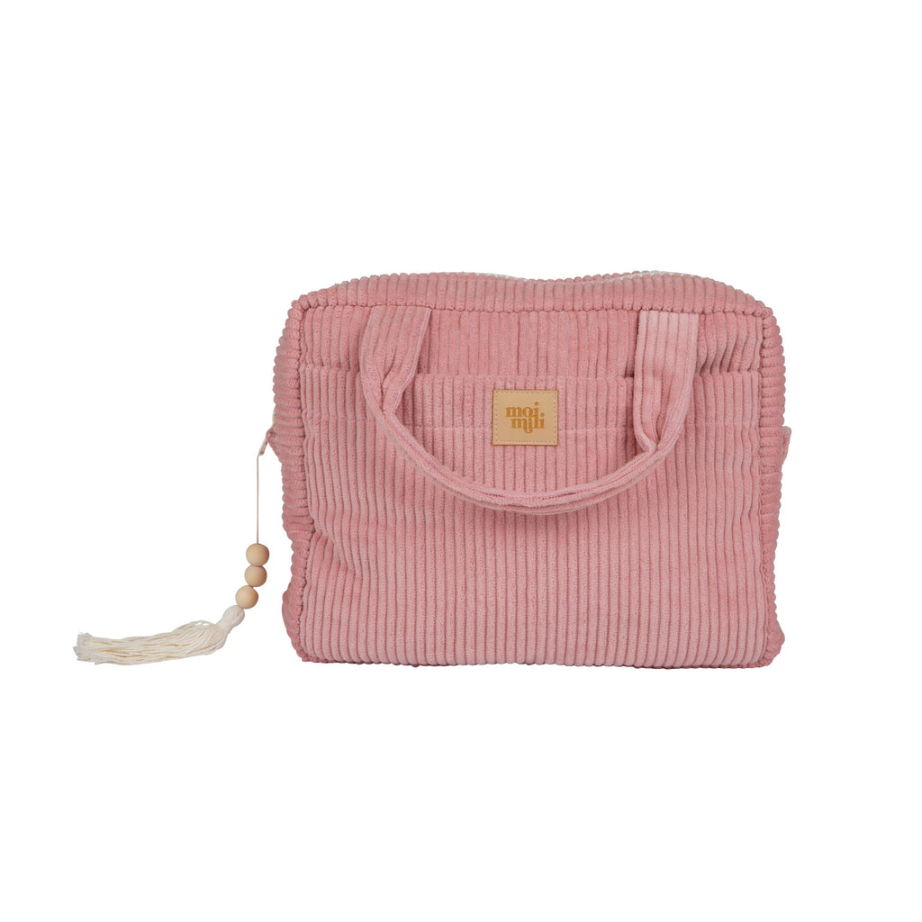 soft baby pink cotton makeup bag open on a cozy bed, showing its inner waterproof pocket and gentle handmade texture