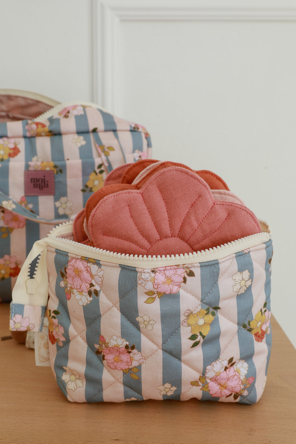 elegant blue striped cotton makeup bag set open to reveal its waterproof interior and pockets