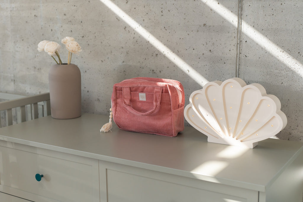 chic coral cotton makeup bag set with two sizes laid flat on a rustic wooden table