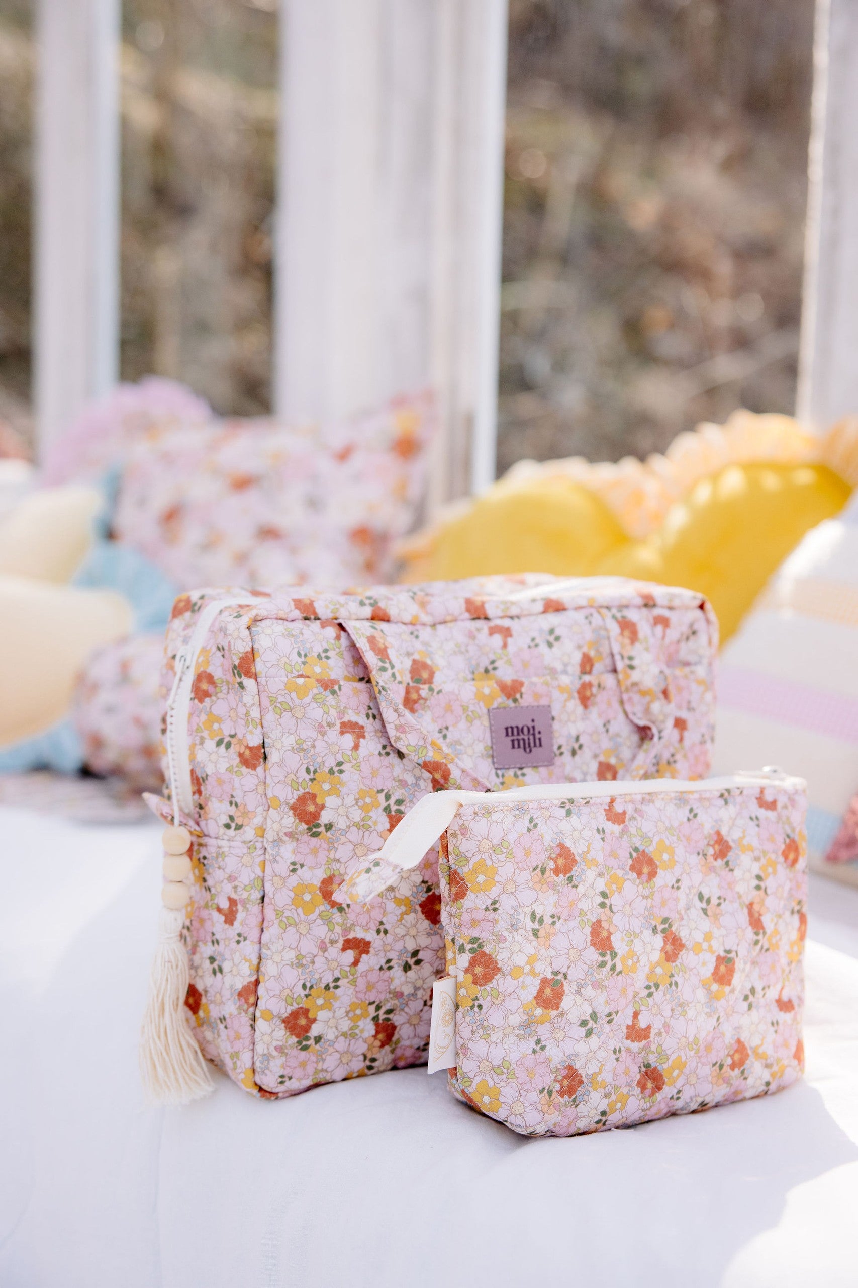 handmade spring garden makeup bag set of two on a rustic wooden table