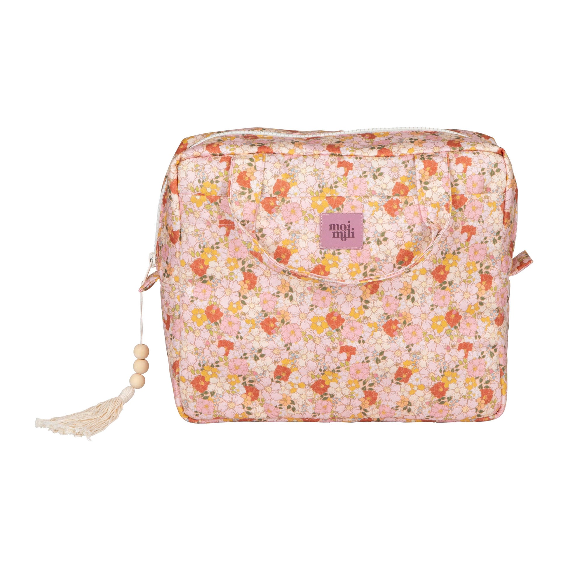 playful spring garden makeup bag set of two, open on a sunlit table with colorful contents spilling out