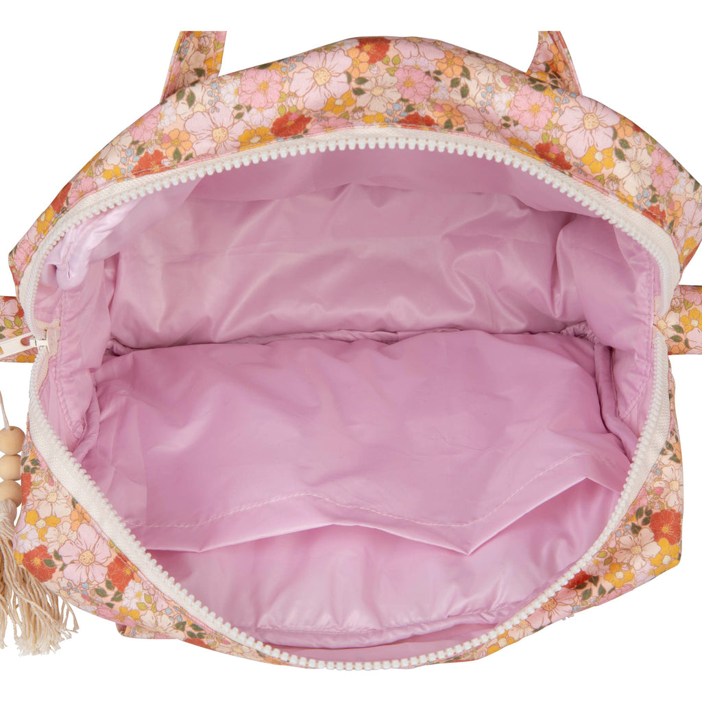 large spring garden makeup bag with floral print, open to show waterproof lining and pockets
