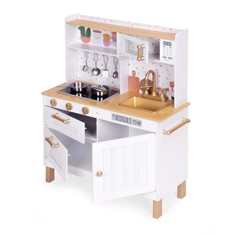 a child's hands turning the knobs on a wooden play kitchen with glowing burners