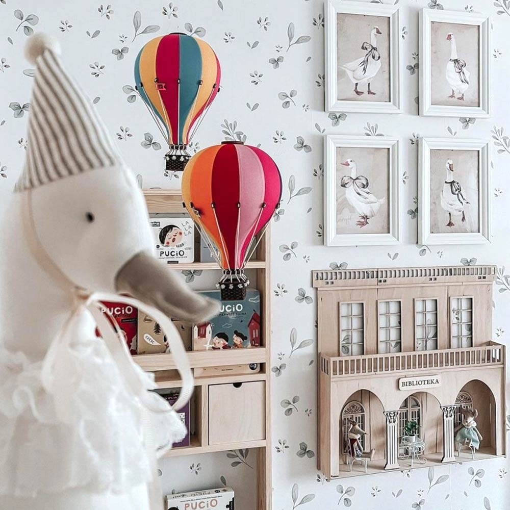 soft focus on a gentle leaves minimini wallpaper pattern with storks and a lake, evoking a comforting nostalgic summer mood for a childs room
