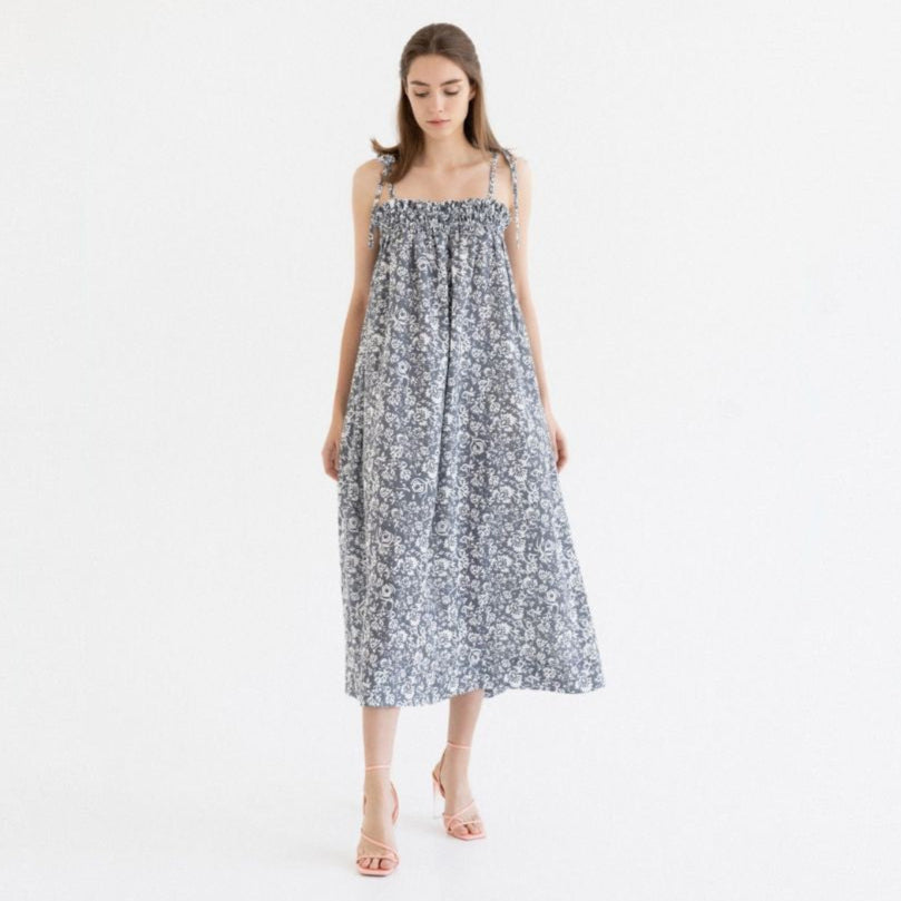 bold linen ballade dress with porcelain flowers print on a model in golden hour light