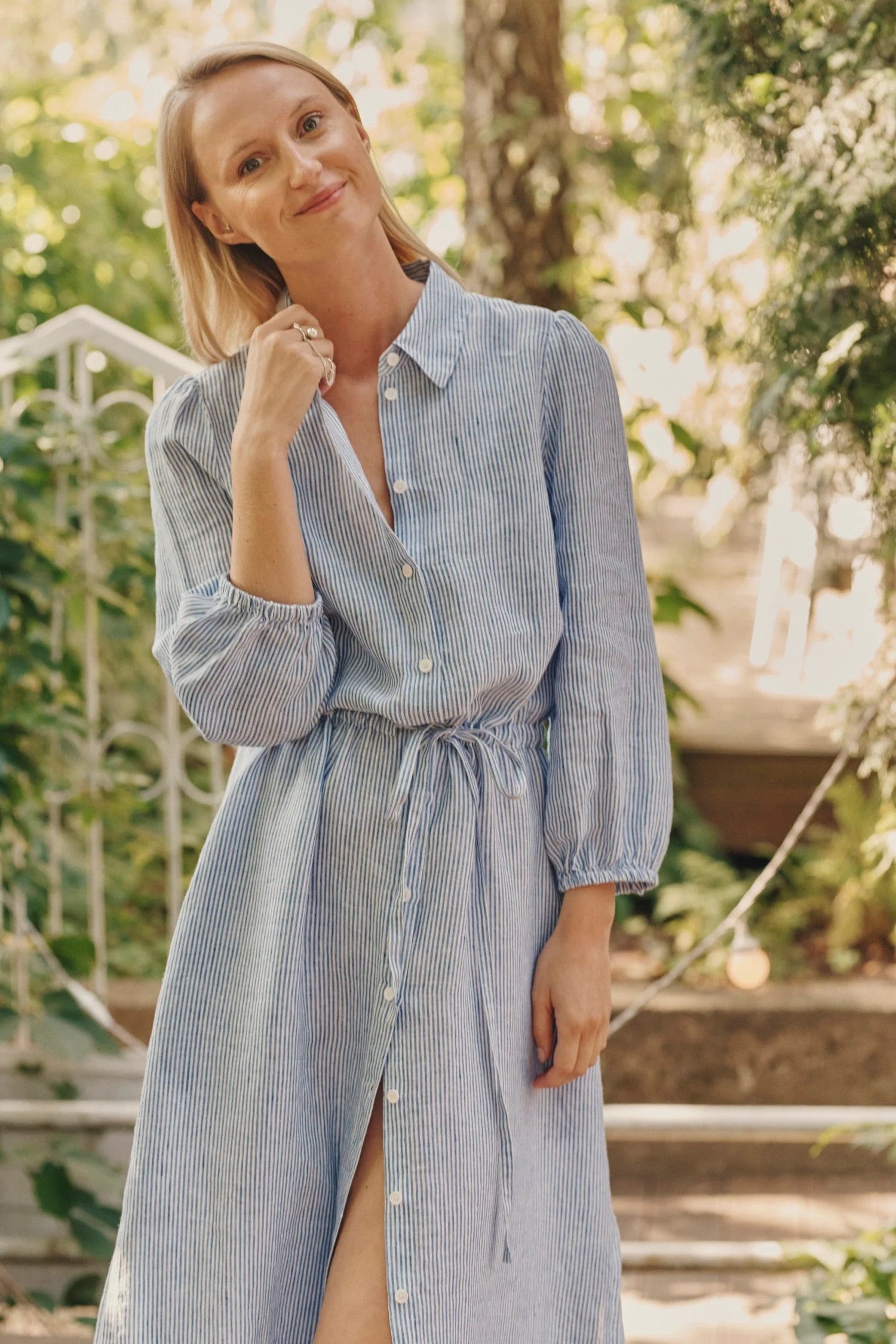 elegant blue and white striped linen dress with a relaxed fit and adjustable drawstring belt