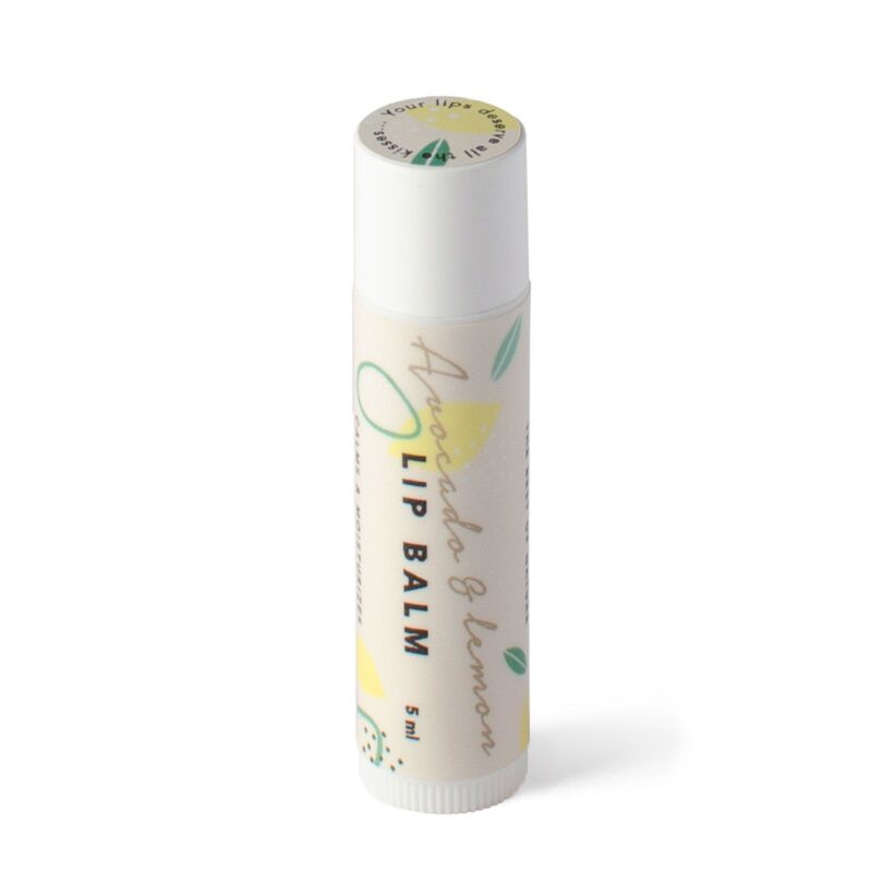 bold close-up of avocado and lemon lip balm pot with vibrant citrus glow