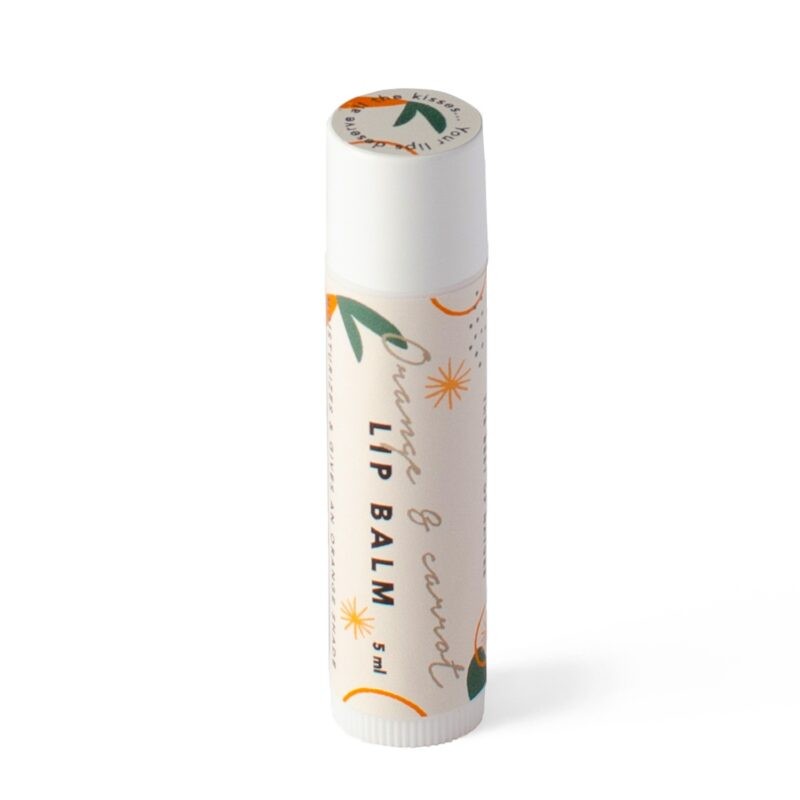 bold close-up of orange and carrot lip balm with a sunlit citrus glow