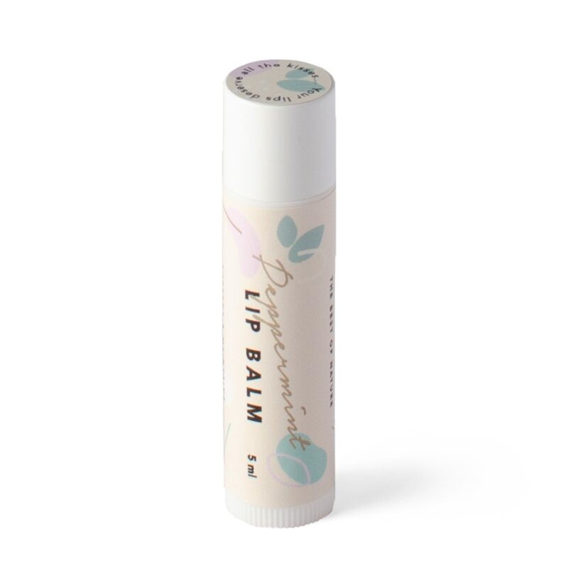 a bold close-up of our peppermint lip balm tin glowing with a cool, invigorating light
