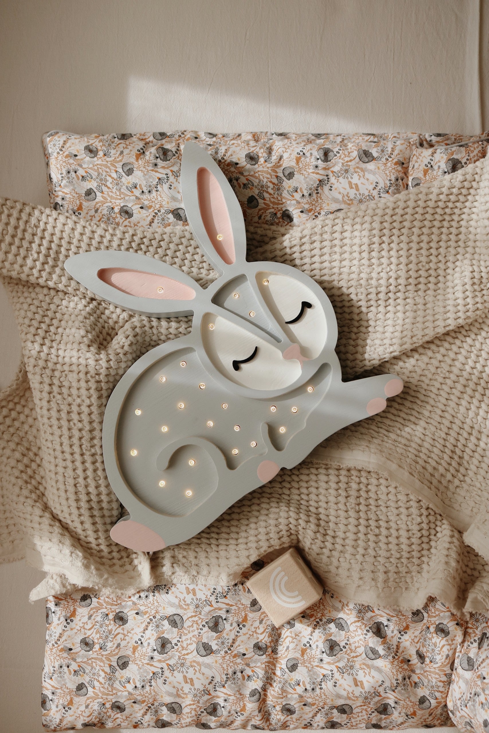 handcrafted pine wood cat lamp casting a soft warm glow in a childs room