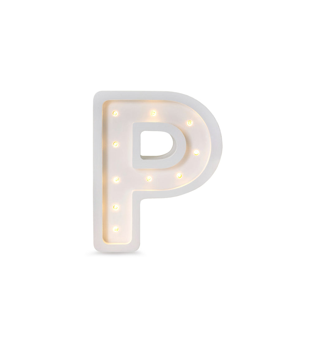 bold solid pinewood letter lamp glowing warmly in a modern kid's room
