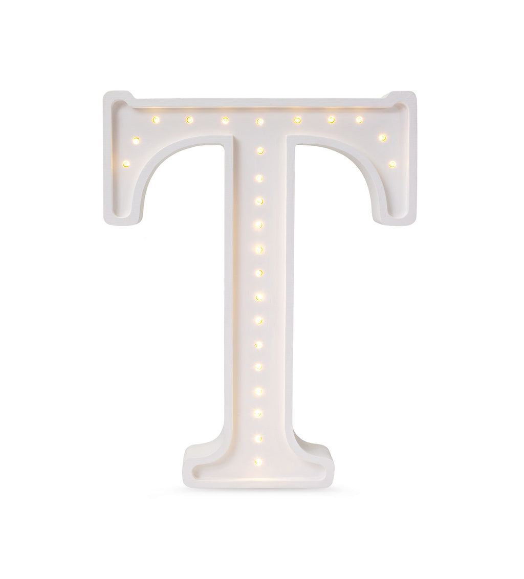 a soft-glow letter t lamp casting a warm, comforting light on a child's nightstand