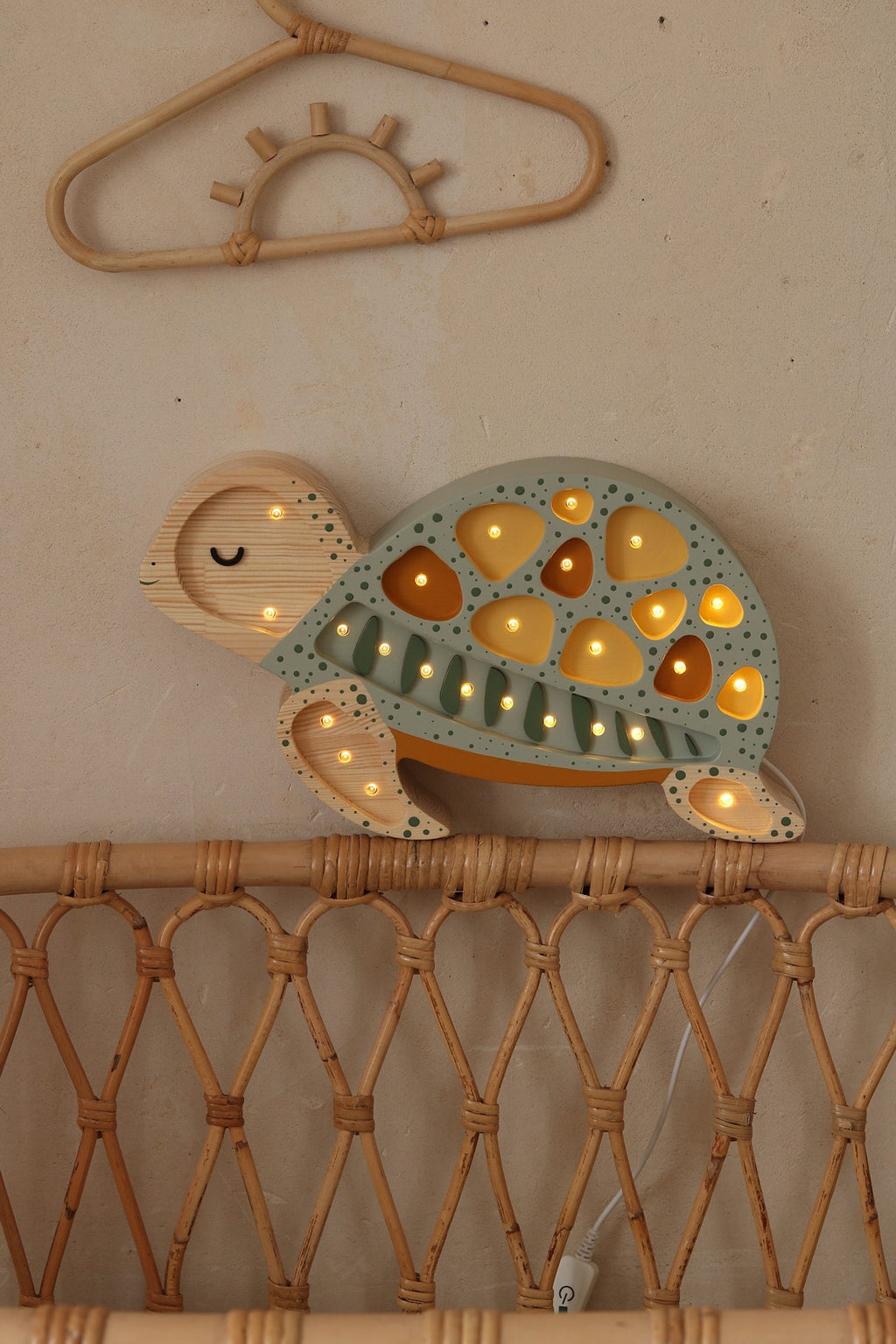 handmade pine wood turtle lamp with remote control on a nightstand