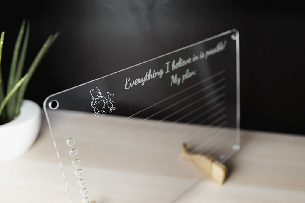 luula kids daily planner mounted on a sunny playroom wall with colorful marker drawings