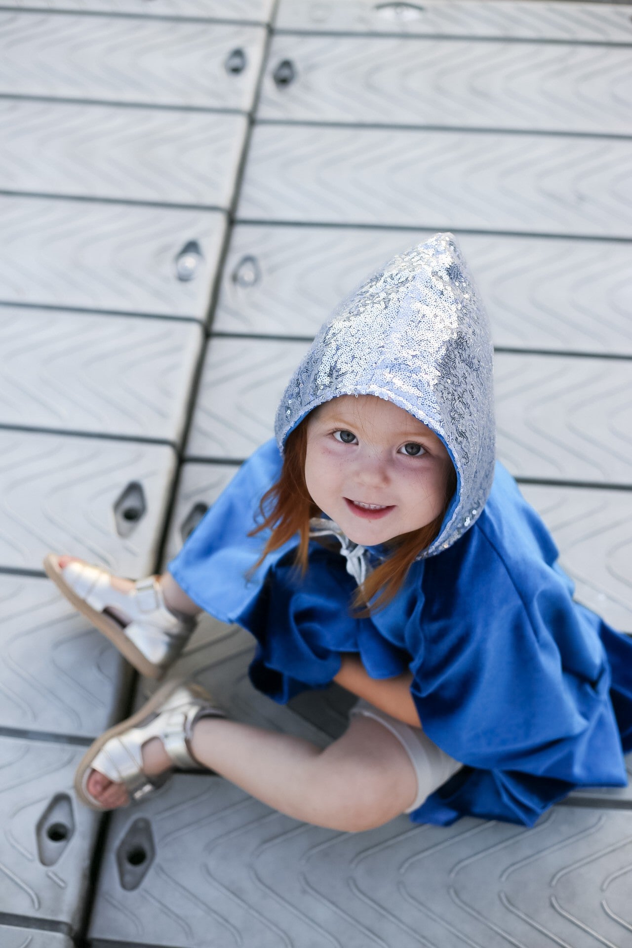playful snow queen cape with hand holes for twirling in the sun