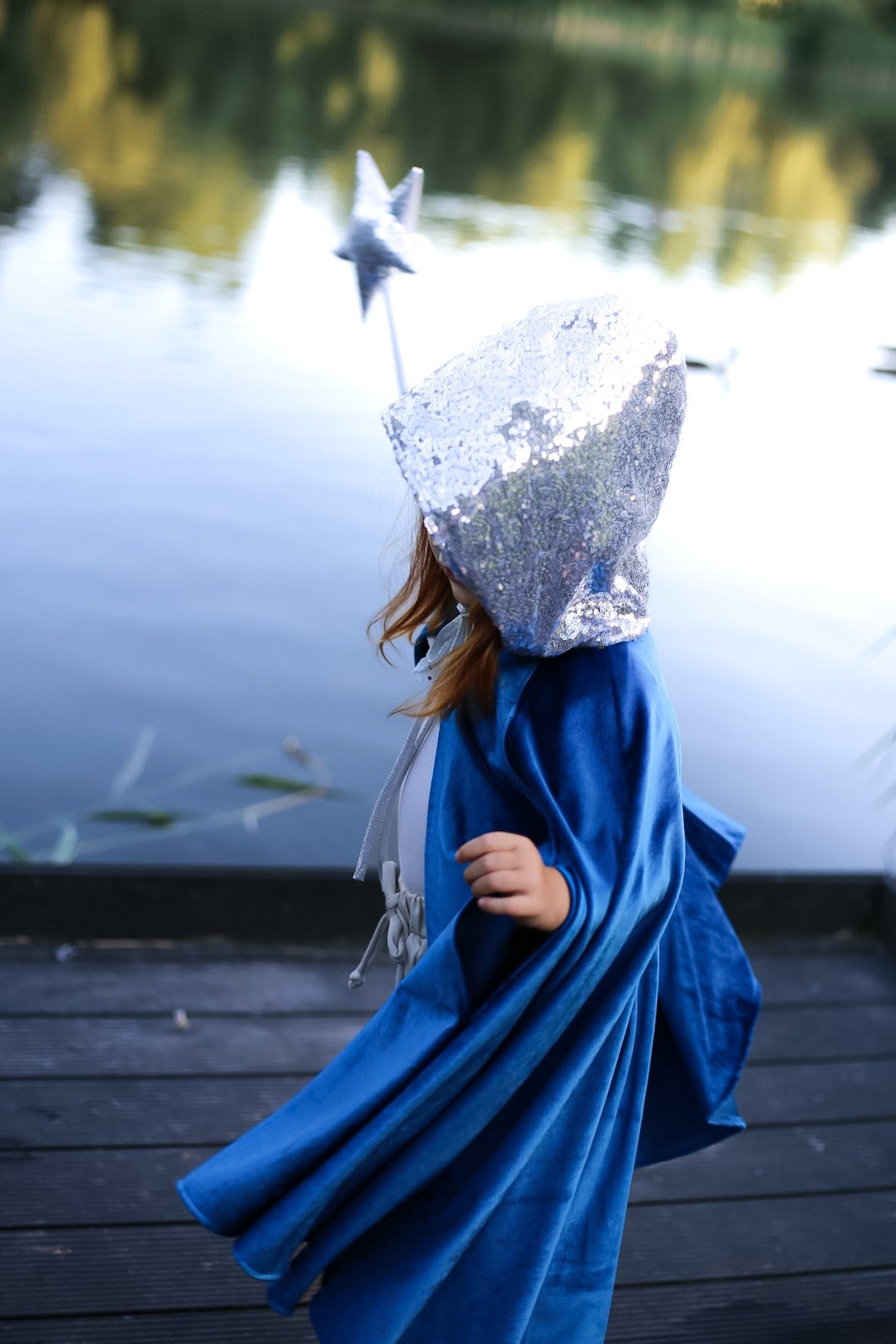 handmade snow queen cape showing practical snap closure and velour fabric texture