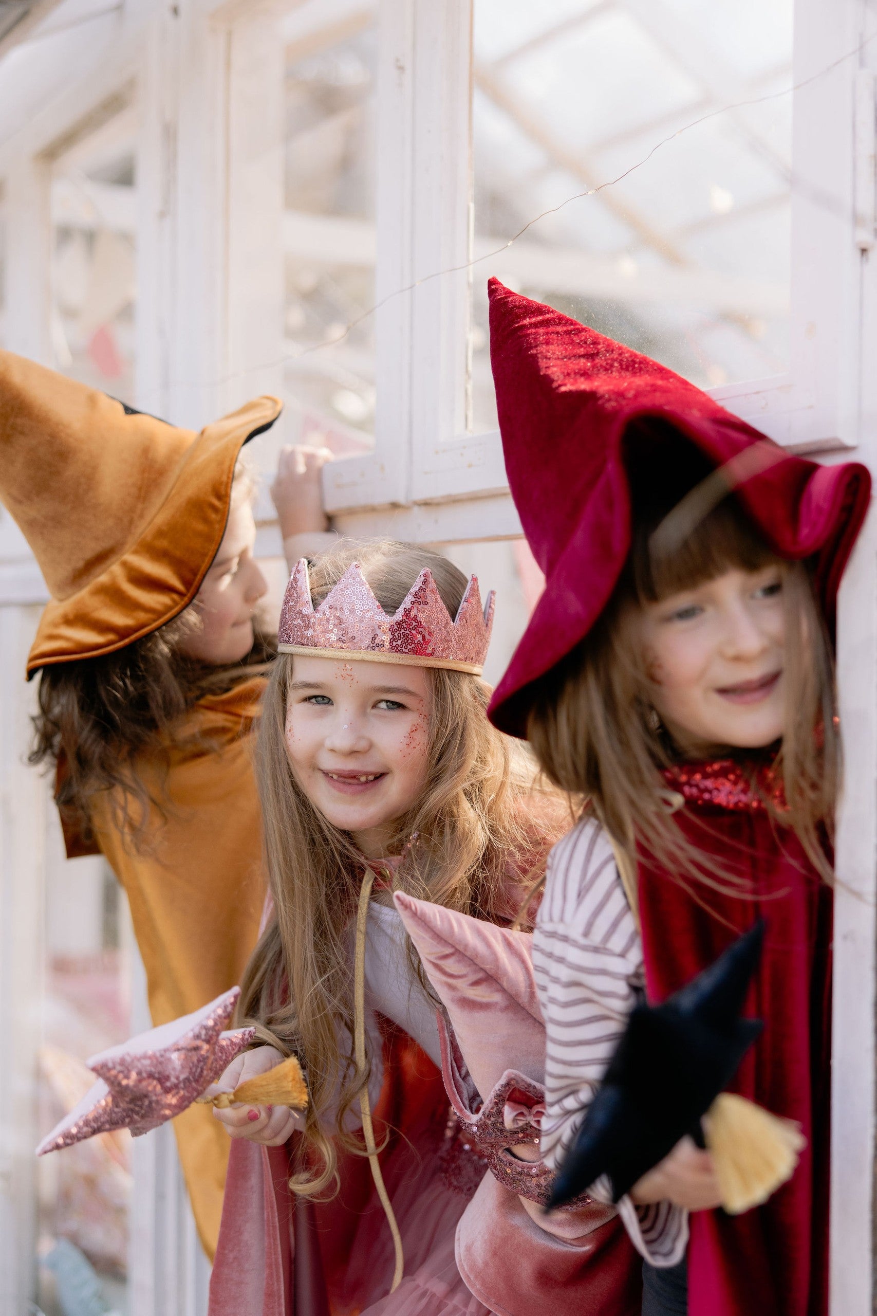 golden velour hooded cape for kids showing snap closure and hand holes for active play