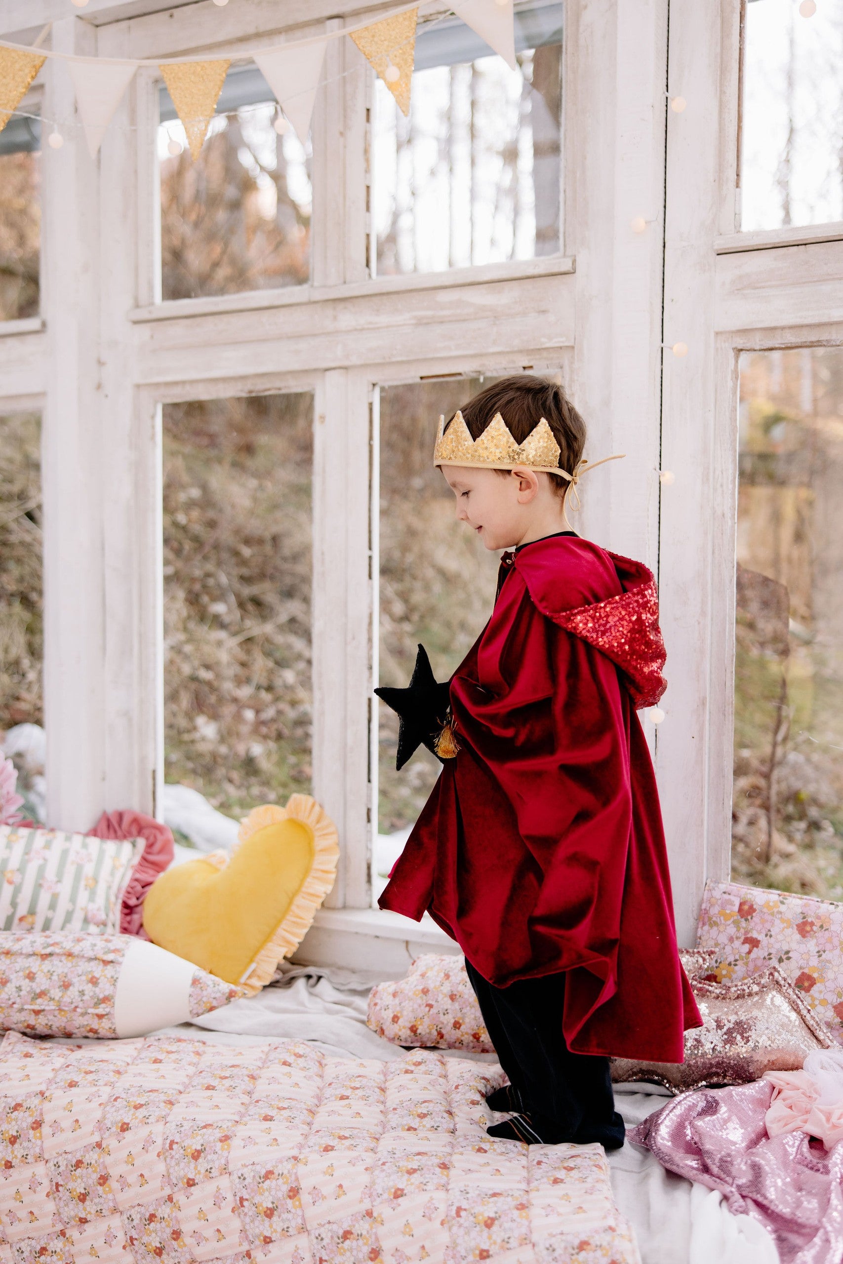 bold red riding hood cape with shimmering velour, deep hood, and snap fastening for magical adventures