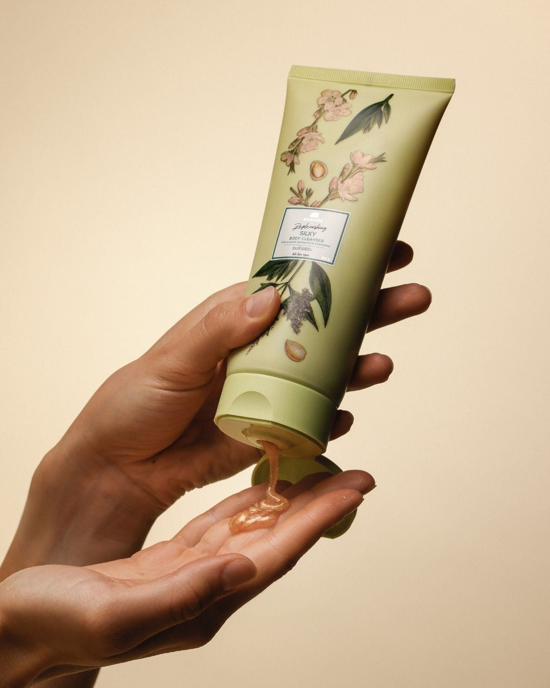 bold shot of magrada x lauren shimmering shower gel bottle with golden light
