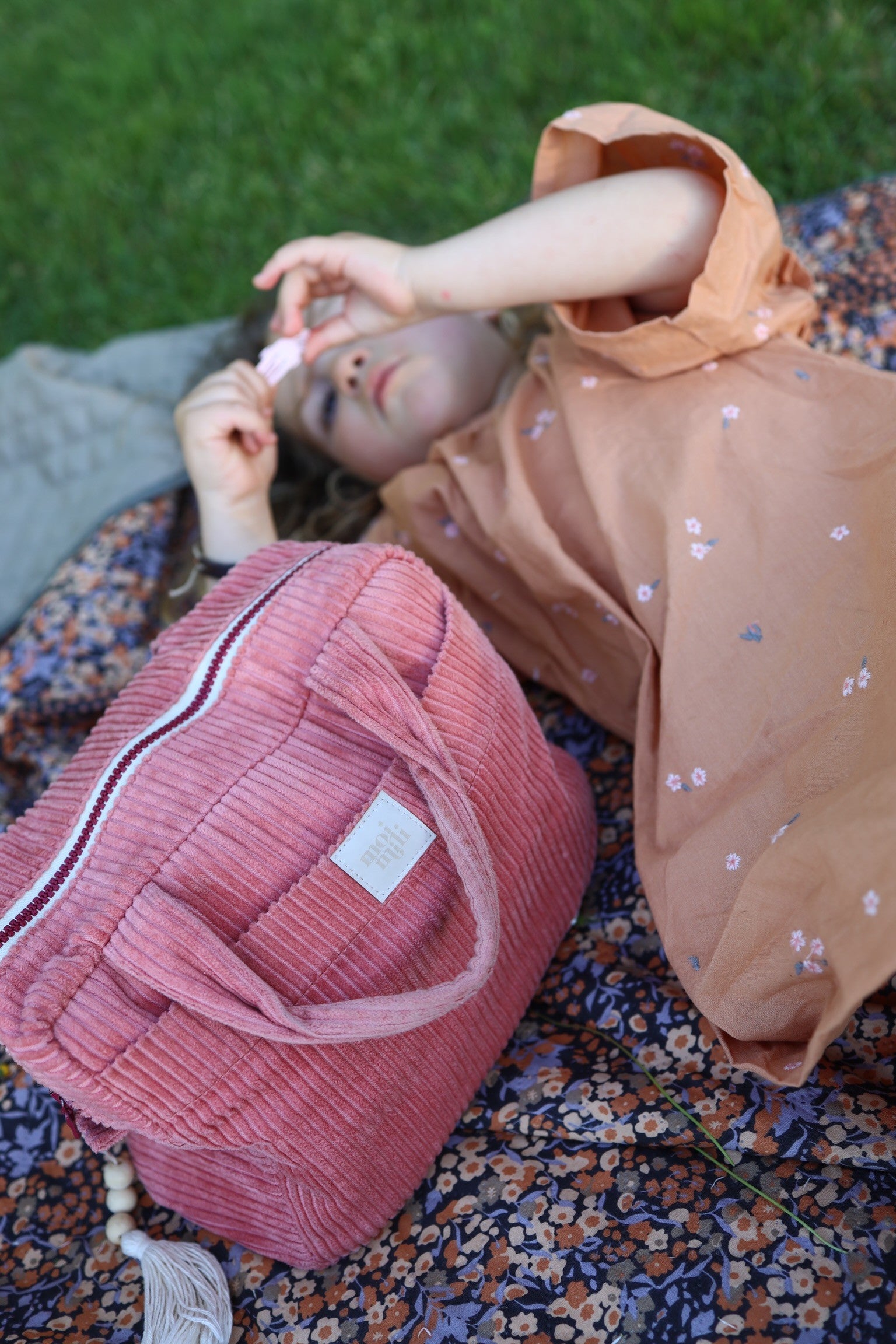 functional coral cotton makeup bag set open showing its inner pockets and waterproof lining