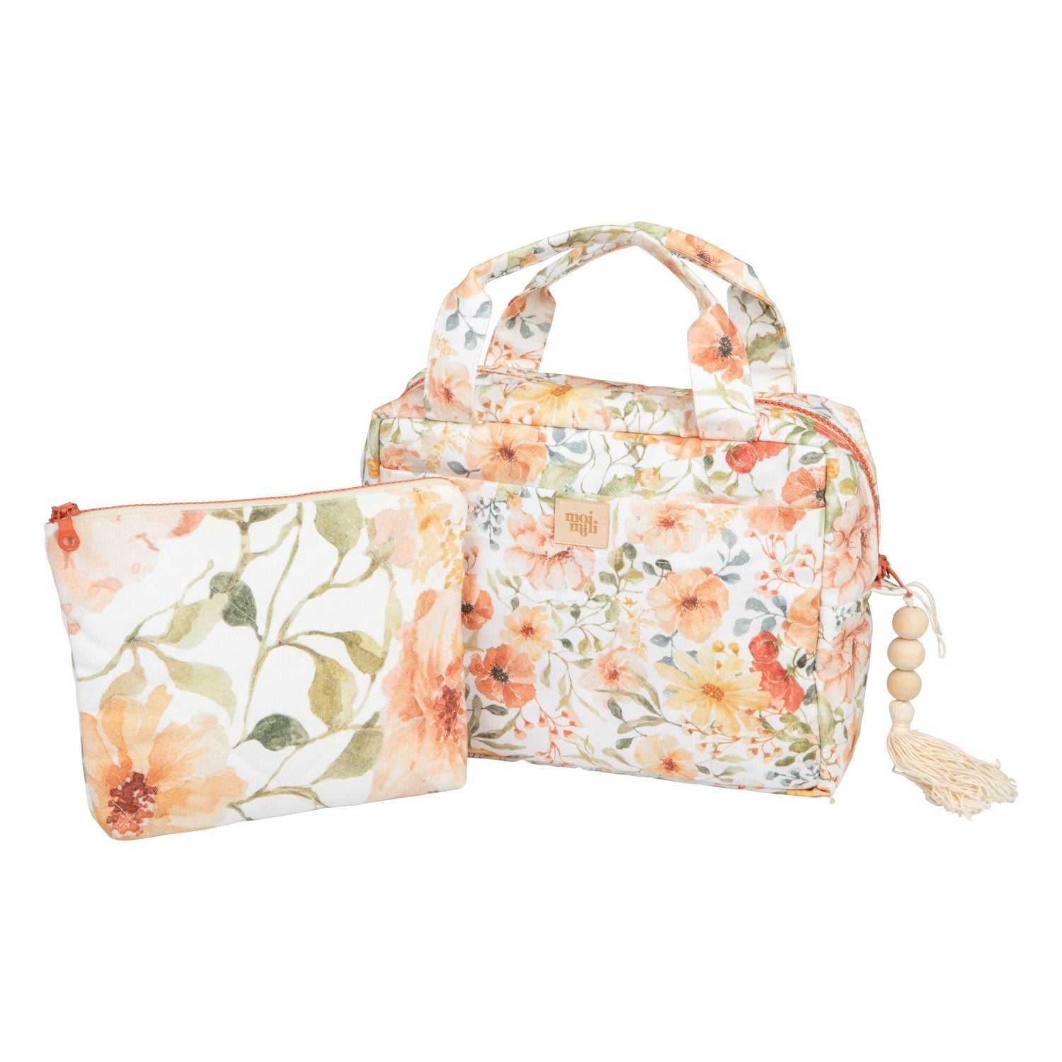 handmade cotton makeup bag set with floral print laid on a rustic wooden table