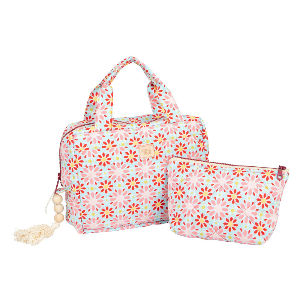 handmade polish makeup bag set of two with vibrant red floral cotton print laid on a rustic wooden table
