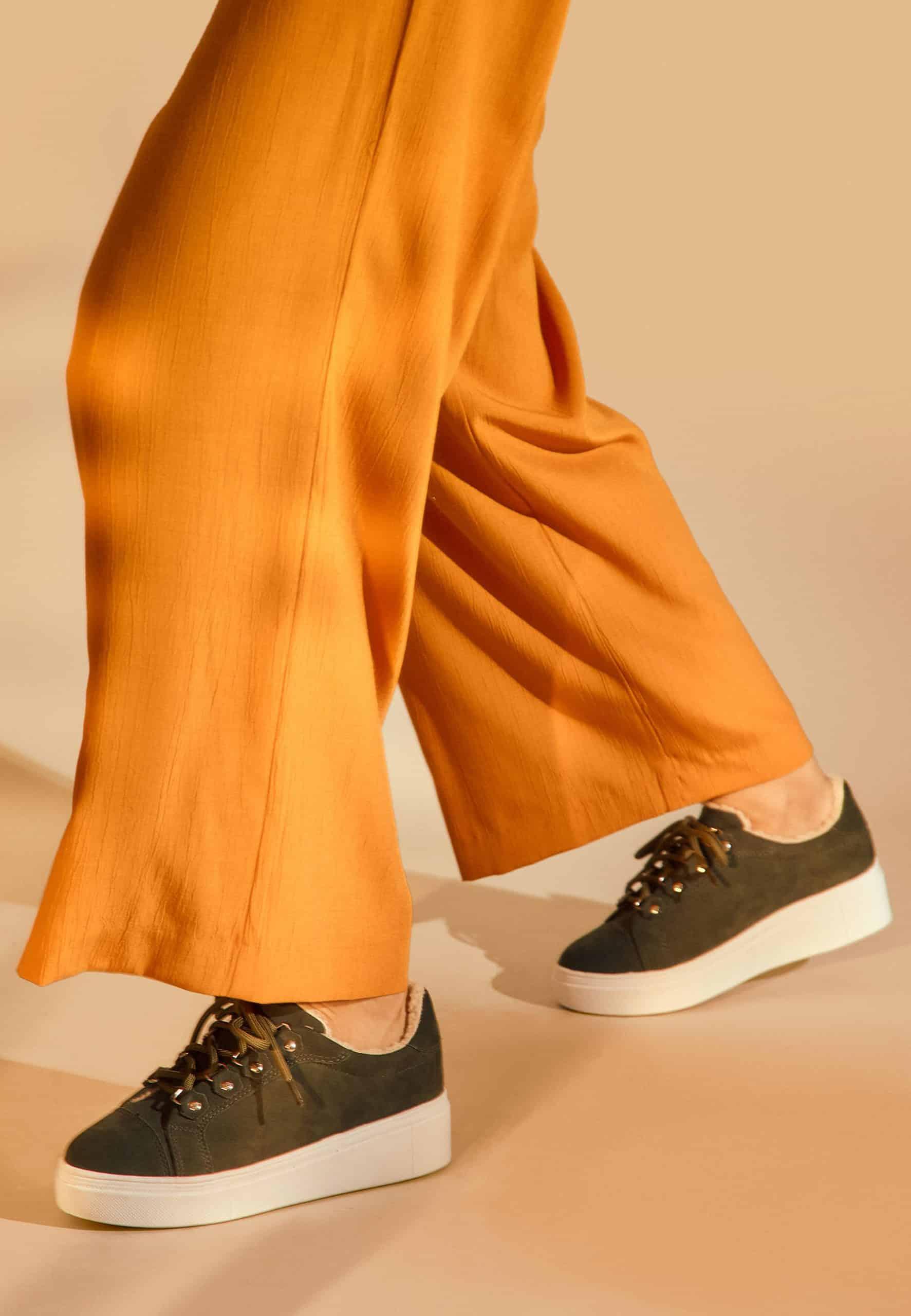 elegant green suede winter sneakers with a flat platform sole, side view