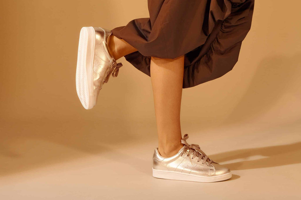close-up detail of the durable rubber outsole on women's metallic leather sneakers