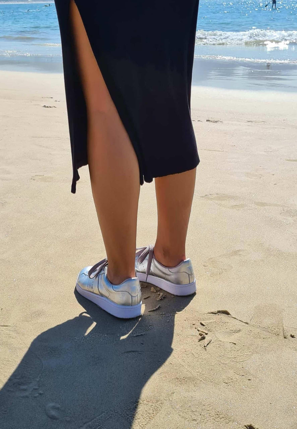 elegant metallic silver leather sneakers with a detailed close-up on the refined lace-up design
