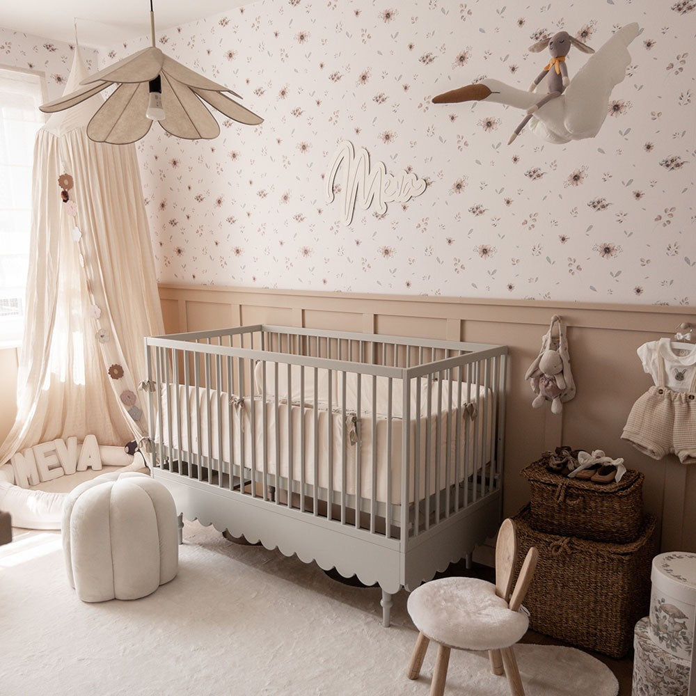 close-up detail of delicate minimini floral wallpaper showing a single stripe's easy-to-trim edge