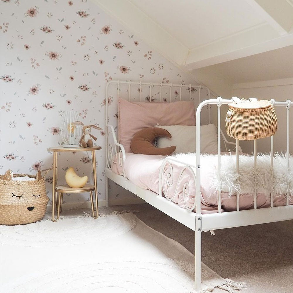 a bold close-up of delicate floral minimini wallpaper on a bright white background