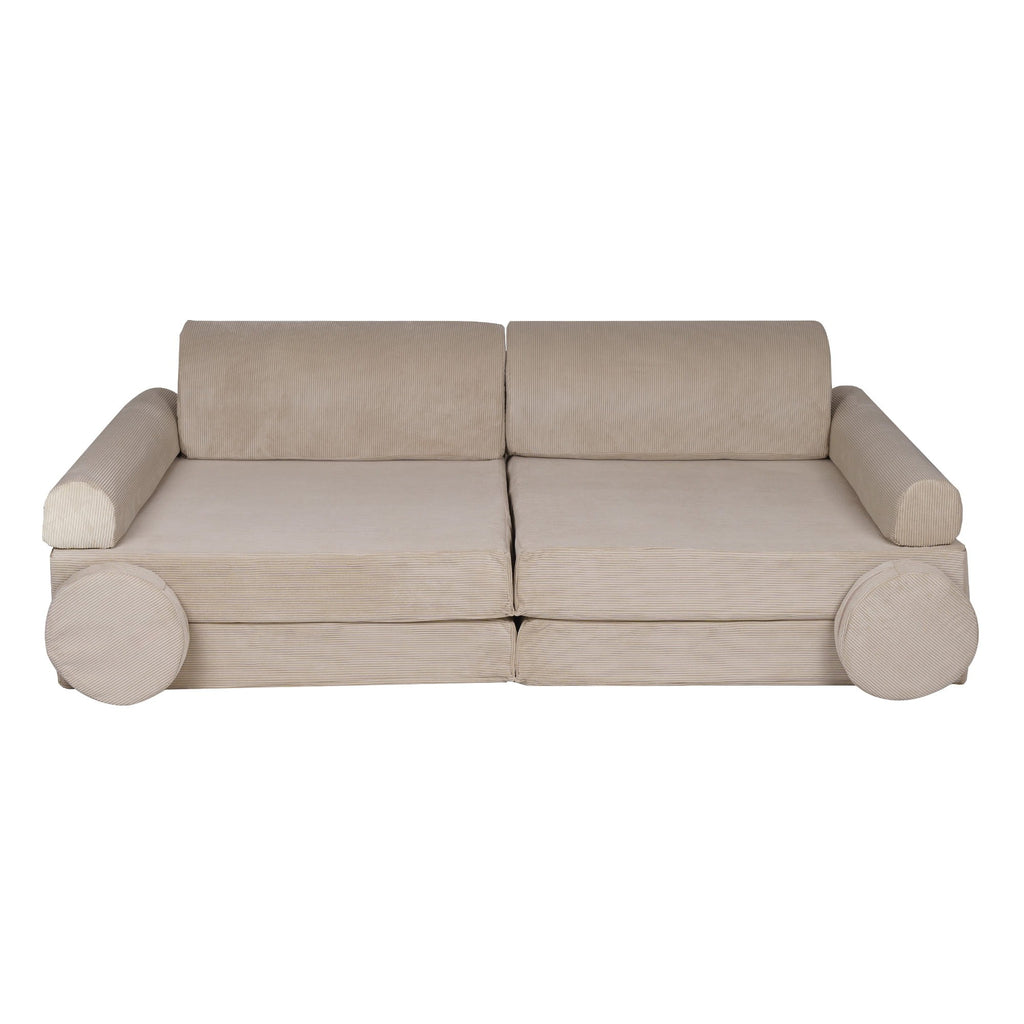 ecru corduroy children's sofa with two poufs in a soft, elegant playroom setting