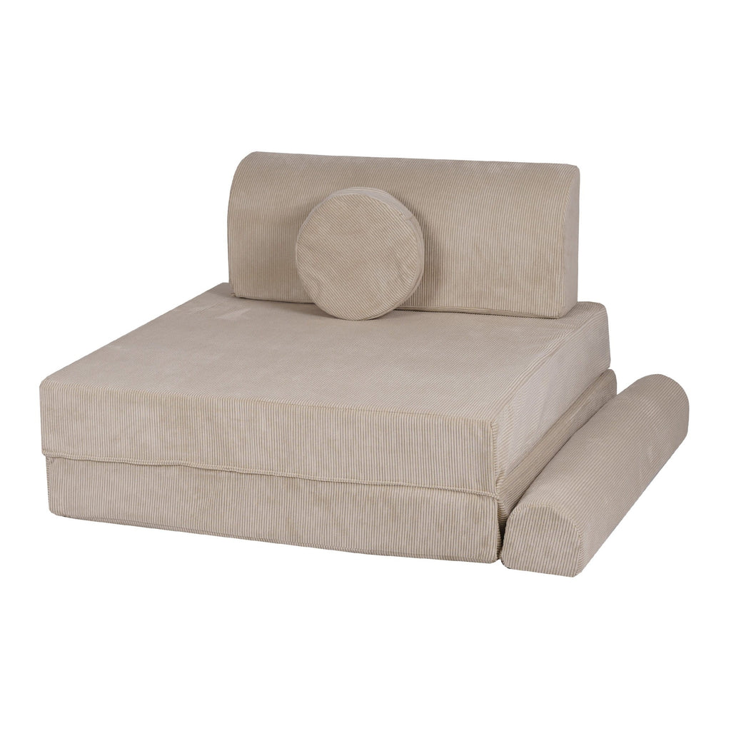 a child's ecru corduroy sofa with two poufs in a bright, minimalist room